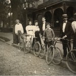 View of a group of bicyclists standing with their bicycles in front of the residence of Atlanta contractor William Bensel at 66 East Ellis Street, between Ivy Street and Courtland Street in Atlanta, Georgia, 1897.