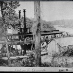 Hawkinsville, 1897. The steamboat, the "City of Hawkinsville," prepares to leave for its maiden trip transporting bales of cotton on the Ocmulgee River.