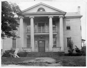 A black and white photograph of the Old Corley House located in Covington, Georgia.