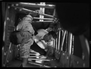 Teen-agers climbing the inside of a radio broadcast tower, Atlanta, Georgia, circa late 1930s or early 1940s. David A. Lennox, Jr. Photographs, Special Collections and Archives, Georgia State University Library.