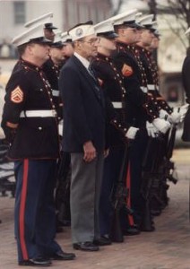 Gene Yearwood, Pearl Harbor veteran, with Marines at Pearl Harbor commemoration ceremonies, Naval Air Station, Atlanta, Georgia, December 7, 1988.  AJCPov01-031CD, Atlanta Journal Constitution Photographic Archives. Special Collections and Archives, Georgia State University Library.