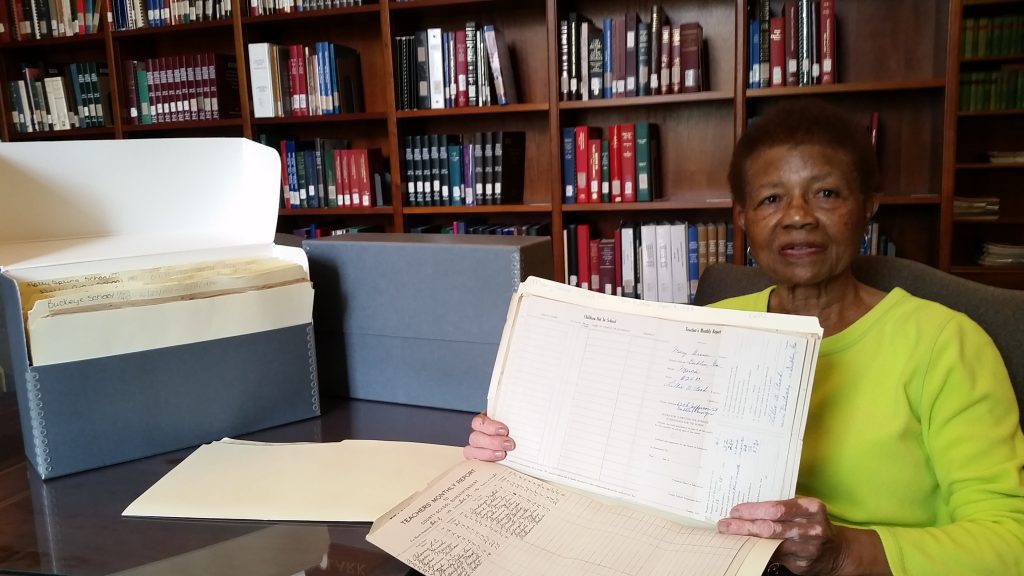 Ms. Susie O’Neal holds teacher monthly reports from Mary Grove School, a school she attended as a child. These reports are from 1936, one year before Ms. O’Neal was born.