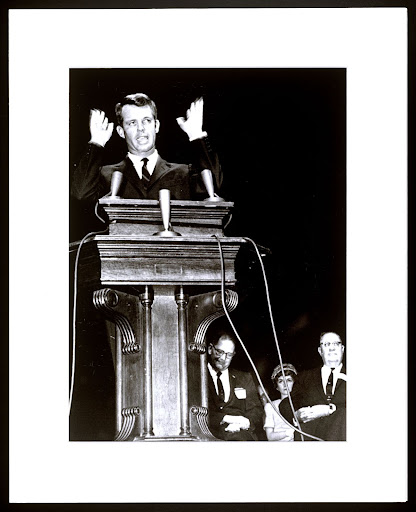 Photograph of Robert F. Kennedy's 1961 Law Day Address at the University of Georgia School of Law showing Kennedy at the podium with University of Georgia School of Law Dean  J. Alton Hosch and University of Georgia President O.C. Aderhold in the background.