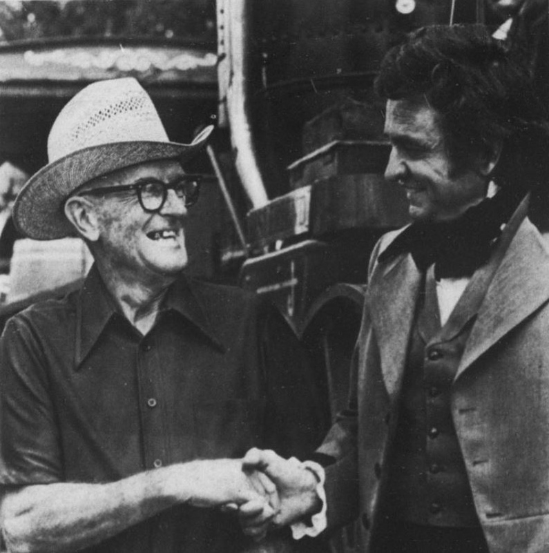 Johnny Cash shaking hands with Melville Brown, who owned the land in Pike County where they filmed portions of the television special. From the September 16, 1974 issue of the Griffin Daily News.